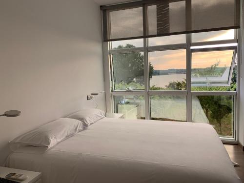 Llit o llits en una habitació de Oktheway Miño Beach