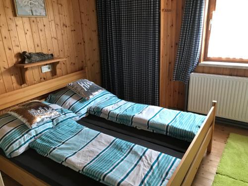 Ένα ή περισσότερα κρεβάτια σε δωμάτιο στο Haus Stadlau