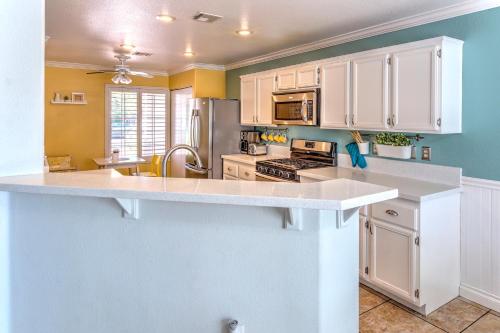 a kitchen with white cabinets and a white counter top at Vegas Vacation in Las Vegas