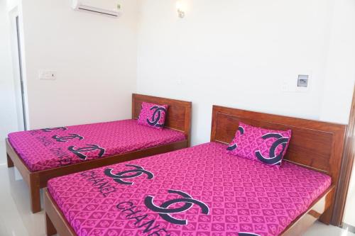 Postel nebo postele na pokoji v ubytování Gia Anh Guesthouse
