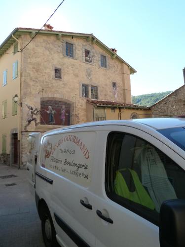 a white van parked in front of a building at Maison Baxter in Prats-de-Mollo-la-Preste