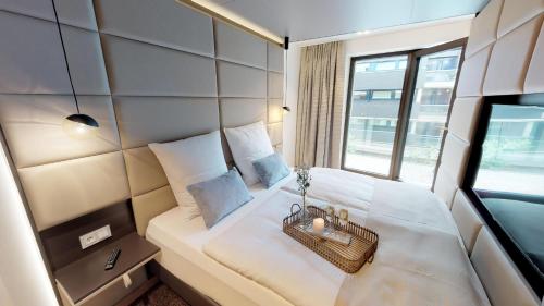 Postel nebo postele na pokoji v ubytování White Pearl Apartment 1.04