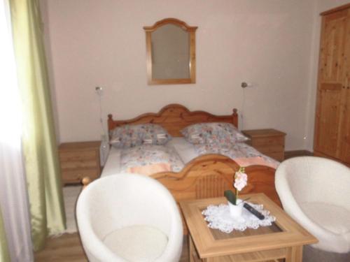 Ένα ή περισσότερα κρεβάτια σε δωμάτιο στο Napfény Apartman