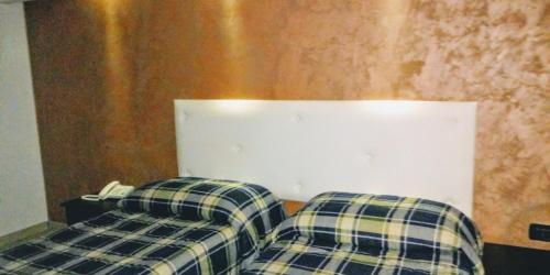 two couches sitting next to each other in a room at Hotel 660 in Bisignano