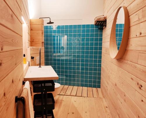 a bathroom with a sink and a mirror at Calle do Reiro, Casa o chalet in Nigrán