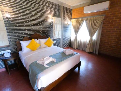 Katil atau katil-katil dalam bilik di Villa Ecotiva