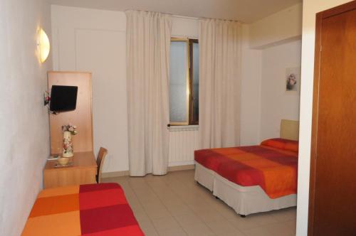 Katil atau katil-katil dalam bilik di Marinetta Bed & Breakfast