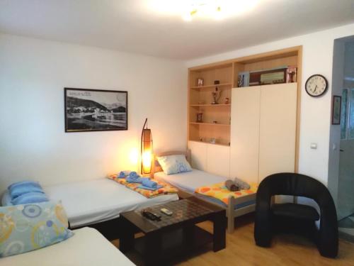 Łóżko lub łóżka w pokoju w obiekcie Apartmani Jovanovic