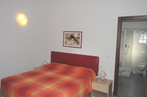 Ένα ή περισσότερα κρεβάτια σε δωμάτιο στο Marinetta Bed & Breakfast
