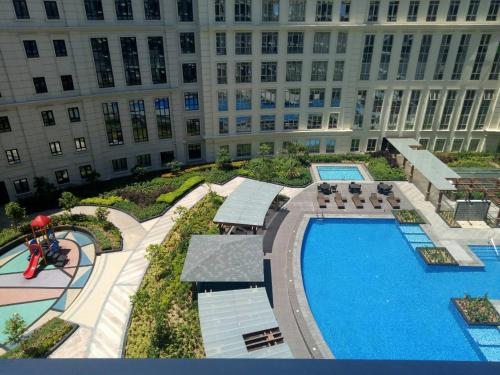 an overhead view of a building with a pool at Eighty One Newport Boulevard in Manila