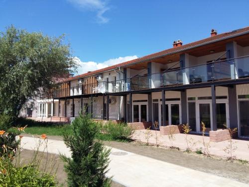 an exterior view of a building with balconies at Wellapartman Zamárdi in Zamárdi