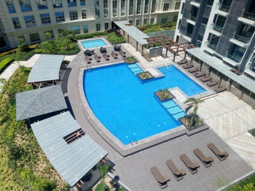 an overhead view of a swimming pool in a building at Eighty One Newport Boulevard in Manila