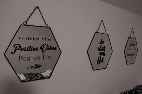 a sign that says positive mind positive vibes positive like at Apartman F&F in Otočac
