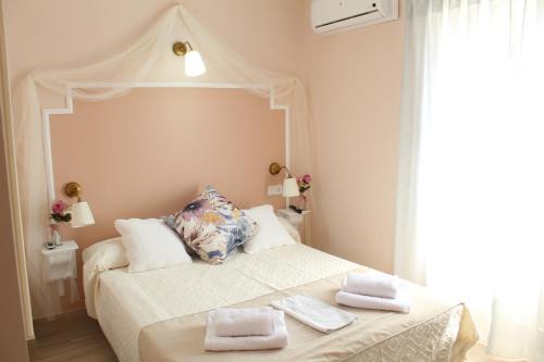 Кровать или кровати в номере Emperador Augusto