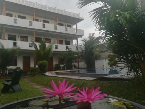 a view of the hotel from the garden at A One Calm Palace in Mirissa