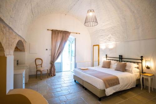 En eller flere senger på et rom på Borgo Cozzana