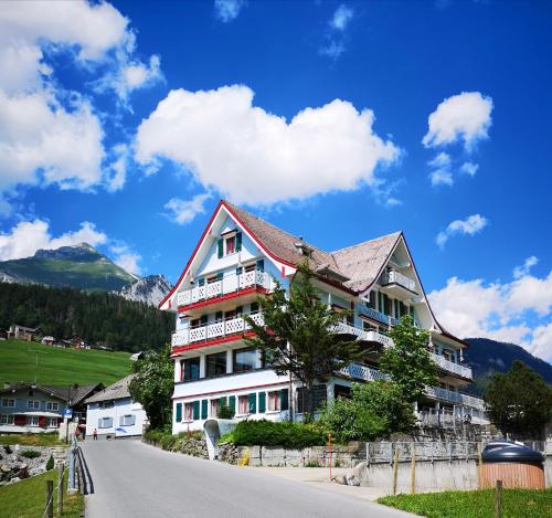 a large building on the side of a road at Gasthaus Friedegg in Wildhaus