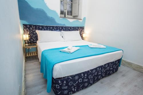 
A bed or beds in a room at La Casa dei Nonni
