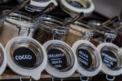 a group of jars of food sitting on a shelf at B&B Boutique Apartment Oberwiesen in Brunico