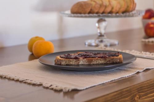a piece of cake on a plate on a table at Trulli Nannì in Locorotondo
