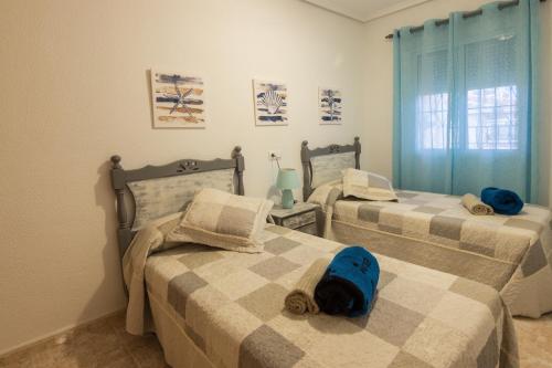 Säng eller sängar i ett rum på Santa Pola, Gran Alacant, Playas cerca, adosado completo, Chillout, Solarium