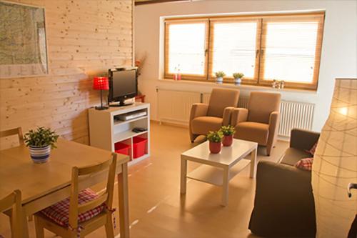 TV a/nebo společenská místnost v ubytování Haus Taekema Appartments