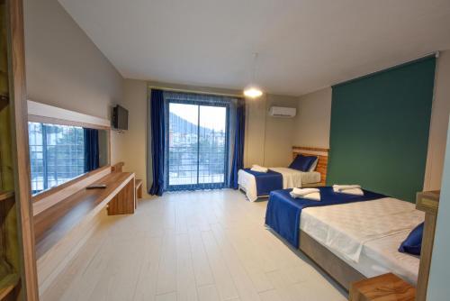 Postel nebo postele na pokoji v ubytování Lidya Hotel
