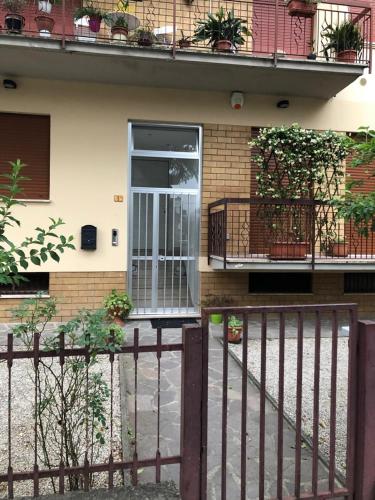 a fence in front of a house with a door at "CASA ROSI" Tel trequattrozero trentatre tredici seiquattrouno in Umbertide