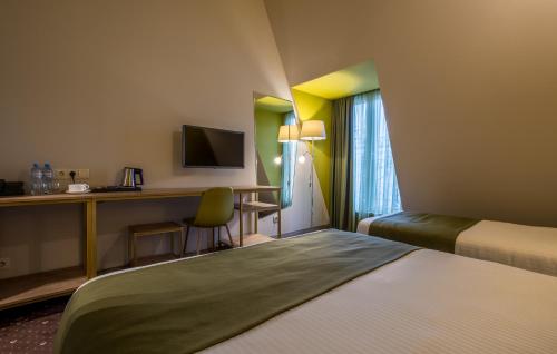 Postel nebo postele na pokoji v ubytování Gladius Inn Boutique Hotel by DNT Group