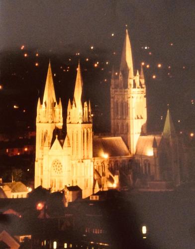 a lit up cathedral at night with lights at Chy Bre in Truro