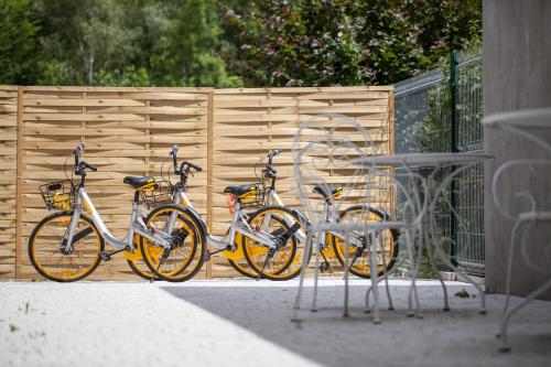 a group of bikes parked next to a wooden fence at Boleslav Home in Sucha Beskidzka
