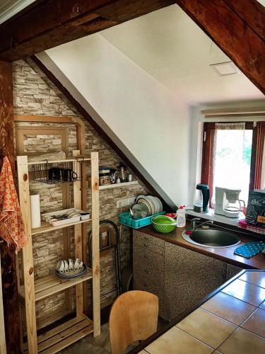 a kitchen with a counter and a sink in a room at Riia 141 Apartment in Pärnu