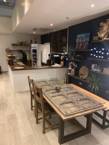 a dining room with a table and a counter at Accra Luxury Apartments at The Gallery in Accra