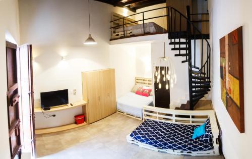 Villana's Hostal Santa Martaにあるベッド