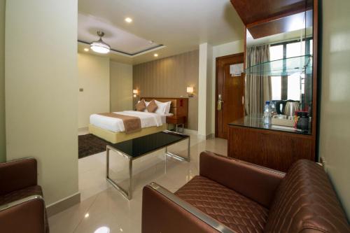 A bed or beds in a room at Unima Grand