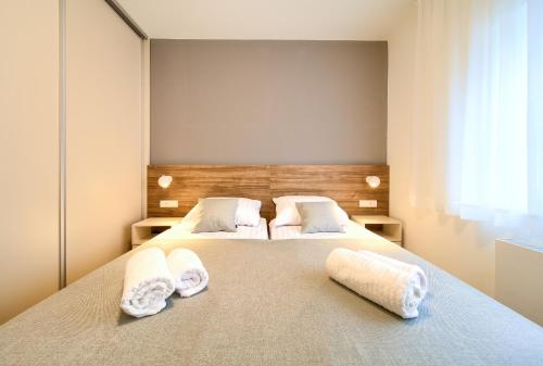 En eller flere senge i et værelse på Residence Veglia