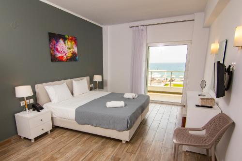 Postel nebo postele na pokoji v ubytování Blue Sea Hotel