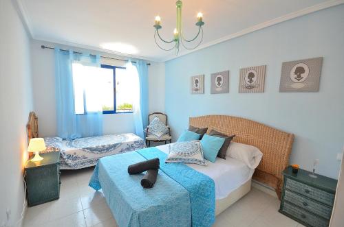 En eller flere senge i et værelse på Sweet Home BellaVista