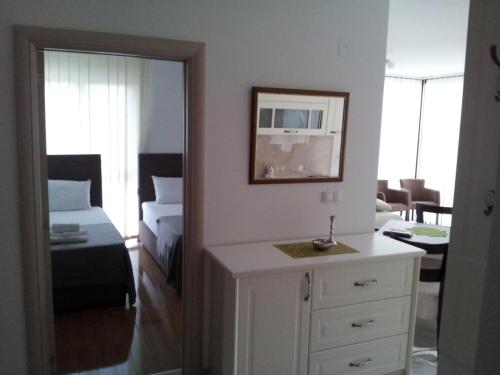 Cama o camas de una habitación en Apartmani MITIĆ