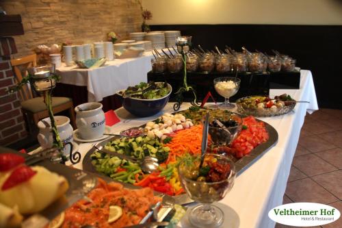 a buffet with many different types of food on a table at Landgasthaus Veltheimer Hof in Porta Westfalica
