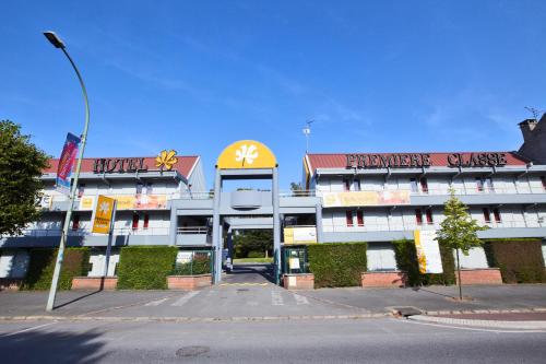 a building with a sign on the front of it at Premiere Classe Lille Nord - Tourcoing in Tourcoing