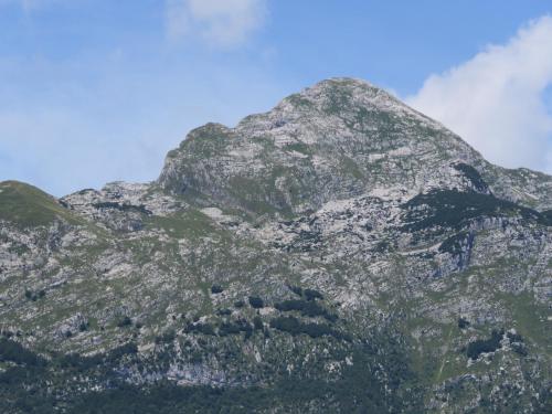 a rocky mountain with a blue sky in the background at Počitniška hiška Jager Čezsoča in Čezsoča