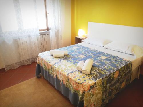 En eller flere senge i et værelse på Home Sweet Home Affittacamere - Lucca