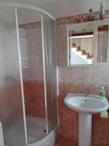 a bathroom with a shower and a sink at APARTMAN Nikolina in Baška