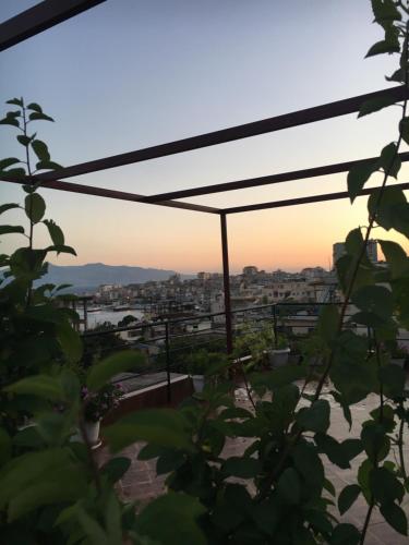 a view of the sunset from the roof of a house at Vila Gjoni in Sarandë
