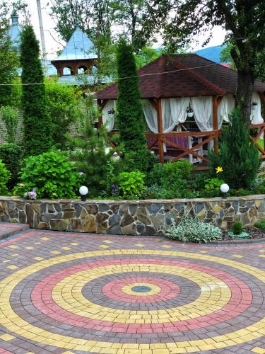 a large labyrinth in a garden with a gazebo at Karpatska Mria in Yaremche