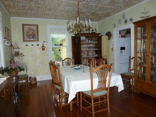 a dining room with a table and chairs at Back INN Time B&B in Kilmarnock