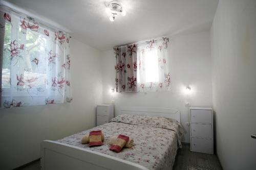 Un pat sau paturi într-o cameră la Apartment Kala