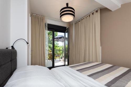 Posteľ alebo postele v izbe v ubytovaní Pampas apartments Mrežnica