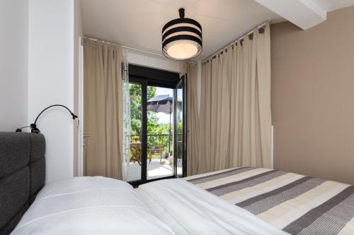 Postel nebo postele na pokoji v ubytování Pampas apartments Mrežnica